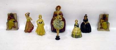 Six plaster figures of ladies in traditional dress and a pair of Egyptian-style bookends (8)