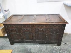 16th/17th century antique oak coffer, the front with four round arched carved panels, chequerboard