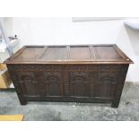 16th/17th century antique oak coffer, the front with four round arched carved panels, chequerboard