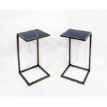 Pair of metal and black glass wine tables of modern oxidised metal frames and an adjustable