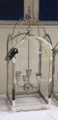 Four-branch hanging lantern within a glazed steel frame, height 85cm (VAT payable on hammer)