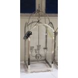 Four-branch hanging lantern within a glazed steel frame, height 85cm (VAT payable on hammer)