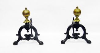 Pair of Victorian brass and iron andiron , a brass coal bucket and assorted fire irons