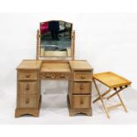 Oak mirror-back dressing table, the central frieze drawer flanked by three short drawers to either s