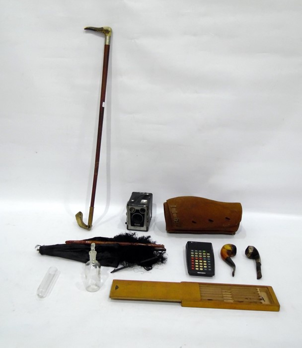 Pair of leather gaiters, parasol, box camera, assorted pipes, gentleman's hunting crop, etc