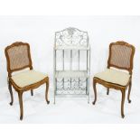 Two French style cane seated and backed dining chairs together with a two tier whatnot with wine