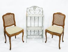 Two French style cane seated and backed dining chairs together with a two tier whatnot with wine