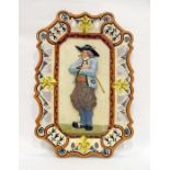 Circa 1875 early French faience ware low relief plaque by Porquier Beau, decorated with Petit Breton