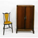 20th century oak cupboard, the interior fitted with shelves, on cabriole legs, width 73cm and a