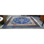 Chinese superwash carpet having blue ground, centr