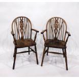 Two Elm seated wheelback Windsor elbow chairs