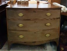 Georgian mahogany bowfront chest of three drawers with brass plates and drop handles, on splayed