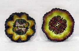 Two Maurice Fouillen Quimper wall plates decorated with stylised seashell and seaweed, each