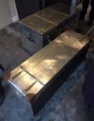 Two steel trunks as coffee tables in a brushed steel effect finish