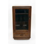 Ercol Furniture glazed cabinet, the panelled door enclosing shelf with drawer below, width 50cm