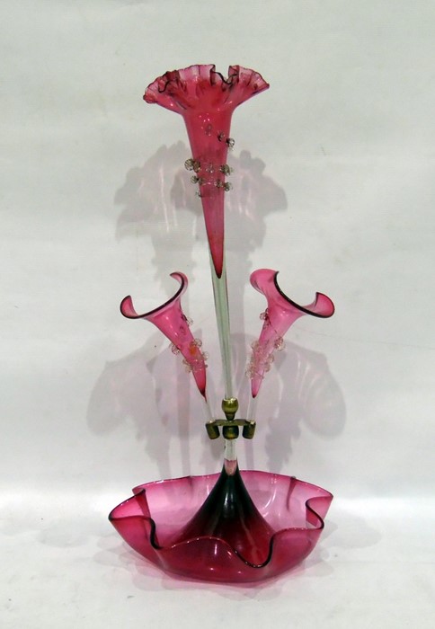 Pink glass epergne with three bowls as flowerheads, 55cm high