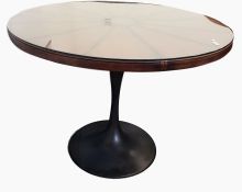 Pair of contemporary circular leather top tables with loose glass covers, raised on bronze metal-