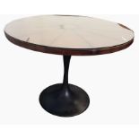 Pair of contemporary circular leather top tables with loose glass covers, raised on bronze metal-