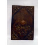 Embossed brown leather cover with brown leather handle embossed armorial and floral and shield