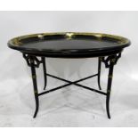 Oval moulded tray-top coffee table in the Oriental style, having floral and foliate decorative rim