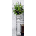 Pair of white composition planters of classical urn design with a pair of panelled pedestals, on a