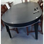 Contemporary black lacquer dining table with rounded ends, on square tapering legs, with two extra