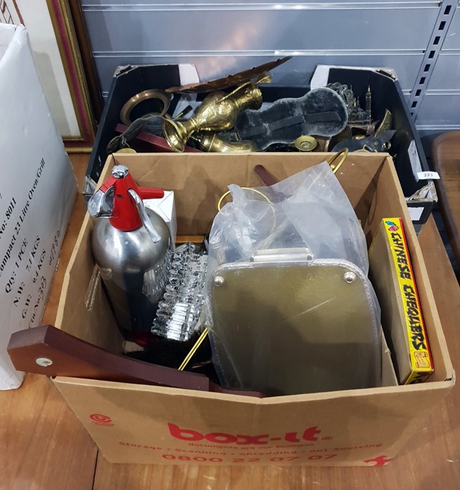 Two boxes of miscellaneous items to include horse brasses, brass candlesticks, further metalware,