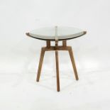 Contemporary designer lamp/coffee table, the circular plate glass top on a beech underframe, 56cm