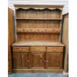 Reproduction pine dresser, the two shelf open plate rack with six small drawers, three frieze