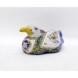 Devres faience seagull-shaped bowl decorated with floral sprays, a Breton crest to chest, marked 'D'