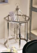 Four-light metal hanging lantern with chromed steel octagonal frame (VAT payable on hammer)