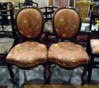 Pair of Victorian cameo-backed standard chairs with floral patterned upholstered backs and seats,