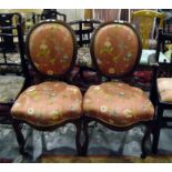 Pair of Victorian cameo-backed standard chairs with floral patterned upholstered backs and seats,