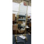 Gilt metal swing frame cheval mirror on reeded supports and splayed legs, height 148cm