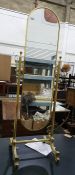Gilt metal swing frame cheval mirror on reeded supports and splayed legs, height 148cm