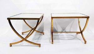 LOT WITHDRAWN Pair of mirror glass topped side tables with gilt metal cross-frame supports, length