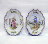 Pair of Henriot Quimper wall plates, one decorated with Petit Breton pipe smoker, the other Petite