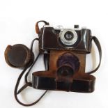 Leica I Model C, circa 1930, serial number 25883, with leather case and lens attachment in
