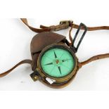 19th century brass-cased compass by Elliot Brothers of London with green-coloured dial, prismatic