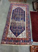 Caucasian style wool rug, the midnight blue field with allover herati and having ivory spandels,