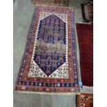 Caucasian style wool rug, the midnight blue field with allover herati and having ivory spandels,