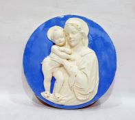 Modern Italian blue and white wall plaque in the style of Della Robbia, of circular form depicting