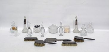 Five-piece silver-backed dressing table set comprising hand mirror and two pairs of brushes, all