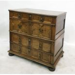 17th century style oak chest of four long drawers, variously graduated, each with pair brass drop