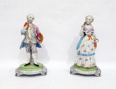 Pair of continental bisque porcelain figures of a gentleman and lady in 18th century costume, on