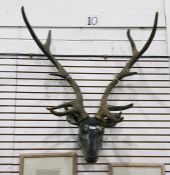 Wall-mounted carved wooden deer's head with large faux antlers (VAT payable on hammer)