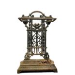 Cast iron umbrella stand with scrolling decorative back panel, removable drip tray
