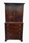 19th century mahogany chest on chest with moulded pediment, two cupboard doors raised upon a base of