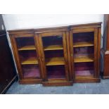 19th century walnut breakfront display cabinet having three cupboards, each with two shelves