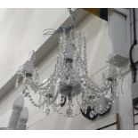 Five-branch electrolier with glass drops  The chandelier measures very approx 49cms diam and 50